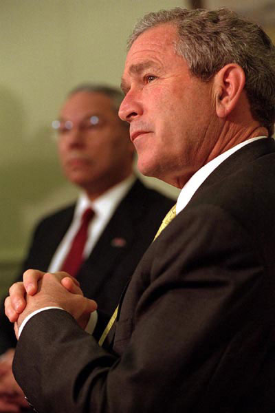 President George W. Bush with Secretary of State Colin Powell at a photo opp on Monday June 18, 2001 in the Oval Office. White House Photo by Susan Sterner.