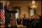 President George W. Bush is applauded in the East Room of the White House, Friday, Oct. 7, 2005, as he offers remarks in celebration of Hispanic Heritage Month. President Bush also honored recipients of the President's Volunteer Service Awards at the event. White House photo by Shealah Craighead