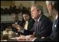 President George W. Bush speaks to reporters at the end of his Cabinet Meeting, Thursday, Dec. 11, 2003. White House photo by Eric Draper.