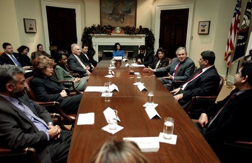 President George W. Bush meets with Iraqi Senior Diplomatic Representative Rend Al-Rahim and members of Iraq's National Symphony Orchestra in the Roosevelt Room Wednesday, Dec. 10, 2003. President Bush and Ms. Al-Rahim attended a performance by the orchestra at the Kennedy Center Dec. 9, 2003. White House photo by Paul Morse