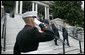 President George W. Bush walks downs the steps of the Dwight D. Eisenhower Executive Office Building with Defense Secretary Donald Rumsfeld after signing H.R.4613. White House photo by Eric Draper