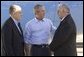 President George W. Bush and former New York City mayor Rudi Giuliani talk with Freedom Corps greeter Frank Ontiveros in Las Cruces, New Mexico on Thursday August 26, 2004. White House photo by Paul Morse.