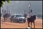 With mounted escorted, a limousine carrying the President and Mrs. Bush, head to Rashtrapati Bhavan, the official residence of the President of India in New Delhi, Thursday, March 2, 2006. White House photo by Paul Morse