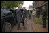 Prime Minister John Howard welcomes President George W. Bush to the Australian Ambassador's Residence Sunday, May 14, 2006.