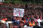 A military mom waits to greet Laura Bush with a special message during Mrs. Bush's visit to Ft. Jackson, South Carolina Tuesday, May 8, 2001. "President Bush also joins me in saying 'thank you' to our nation's military personnel for your service. We deeply appreciate the sacrifices you make for our nation...and the pride and honor you bring to our Armed Services," Mrs. Bush said during a Troop to Teachers rally. White House photo by Paul Morse. 