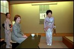 Mrs. Bush and hostess Kiyoko Fukuda, right, share a light moment at the conclusion of a tea ceremony held at Akasaka Palace Monday, February 18, 2002. White House photo by Susan Sterner.