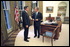 President George W. Bush meets with his new Director of Homeland Security Tom Ridge in the Oval Office shortly before swearing Mr. Ridge in for the position at a White House ceremony Monday, Oct. 8.