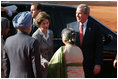 President George W. Bush and Laura Bush are greeted upon their arrival at Rashtrapati Bhavan, New Delhi, India, by India Prime Minister Manmohan Singh and wife, Gursharan Kaur.