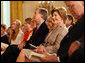 Mrs. Laura Bush smiles as she listens to the acknowledgments of the 2008 Presidential Medal of Freedom recipients during ceremonies Thursday, June 19, 2008, in the East Room of the White House. White House photo by Shealah Craighead