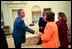 President George W. Bush shakes hands with a survivor of a chemical weapons attack in Halabja, a Kurdish village in Northern Iraq, during an Oval Office meeting March 14, 2003. The attack killed 5,000 people. 