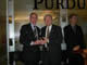 Purdue University President Martin Jischke presents Congressman Visclosky with the Science Coalition's 