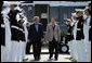 President George W. Bush walks with South Korean President Lee Myung-bak as an honor guard salutes on his arrival Friday, April 18, 2008, at the Presidential retreat at Camp David, Md. White House photo by Shealah Craighead