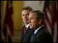 After meeting privately to discuss the situation in Iraq, President George W. Bush and British Prime Minister Tony Blair address the media in the Cross Hall Friday, Jan. 31, 2003. "I appreciate my friend's commitment to peace and security. I appreciate his vision. I appreciate his willingness to lead," said the President of Prime Minister Blair. "Most importantly, I appreciate his understanding that after September the 11th, 2001, the world changed; that we face a common enemy -- terrorists willing to kill innocent lives; that we now recognize that threats which gather in remote regions of the world must be dealt with before others lose their lives." White House photo by Paul Morse