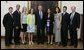 President George W. Bush stands with members of the Duke University Women's Golf team during Championship Day at the White House Tuesday, July 12, 2005. White House photo by David Bohrer