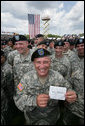 At a rally for the troops attended by Vice President Dick Cheney at Fort Stewart, Ga., a soldier from the Army’s 3rd Infantry Division holds up a message to mom for photographers, Friday, July 21, 2006. White House photo by David Bohrer