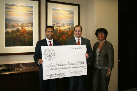 Congressman Jackson presenting check for $215,174 to representatives of the Ingalls Development Foundation