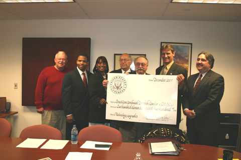 Congressman Jackson with representatives of SouthCom Combined Dispatch Center, holding up giant check for $211,500 for 'Technology upgrades'