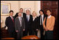 President George W. Bush poses for a photo with international bloggers and new media users following their meeting on human rights Wednesday, Dec. 10, 2008, in the Roosevelt Room at the White House. White House photo by Chris Greenberg