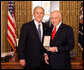 President George W. Bush stands with Arnold Fisher after presenting him with the 2008 Presidential Citizens Medal Wednesday, Dec. 10, 2008, in the Oval Office of the White House. White House photo by Chris Greenberg