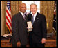 President George W. Bush stands with Bob Woodson, Sr., after presenting him with the 2008 Presidential Citizens Medal Wednesday, Dec. 10, 2008, in the Oval Office of the White House. White House photo by Chris Greenberg