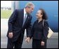 President George W. Bush chats with Freedom Corps greeter Lam Pham after arriving at Tampa International Airport in Tampa, Florida on Friday July 16, 2004. White House photo by Paul Morse