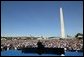 President George W. Bush delivers remarks to thousands of veterans at the National World War II Memorial on the National Mall, Saturday, May 29, 2004. White House photo by Eric Draper