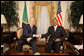 President George W. Bush and President Jakaya Kikwete of Tanzania shake hands before the start of their meeting Sunday, Feb. 17, 2008, at the State House in Dar es Salaam. White House photo by Eric Draper