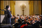 President George W. Bush and Mrs. Laura Bush are joined by Italian Prime Minister Silvio Berlusconi Monday evening, Oct. 13, 2008, as they listen to the Broadway cast of the Jersey Boys perform in the East Room of the White House. White House photo by Eric Draper