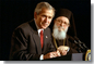 Accompanied by His Eminence Archbishop Demetrios, Primate of Greek Orthodox Church of America, President George W. Bush addresses attendees of the Greek Independence Day Ceremony in the Eisenhower Executive Office Building March 25, 2002. "America and Greece are strong allies, and we're strategic partners," said President Bush. "Our nation has been inspired by Greek ideals, and enriched by Greek immigrants." White House photo by Paul Morse.