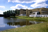 Photograph of main NIEHS building, with the Magnetic Resonance Imaging (MRI) Facility (white section) and F-Module in the foreground