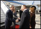 President George W. Bush and Mrs. Laura Bush are greeted upon arrival Wednesday, April 2, 2008, by President Traian Basescu of Romania and Mrs. Maria Basescu at Mihail Kogalniceanu Airport in Constanta, Romania. White House photo by Eric Draper