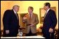 President George W. Bush talks with House Speaker Dennis Hastert and Senate Republican Leader Trent Lott while watching election returns in the White House residence Tuesday night, Nov. 5, 2002.  White House photo by Eric Draper