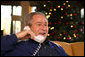 President George W. Bush makes Christmas Eve telephone calls to members of the Armed Forces at Camp David, Monday, Dec. 24, 2007. White House photo by Eric Draper