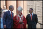 President George Bush walks out of St. Matthew's Cathedral with Theodore Cardinal McCarrick and Supreme Court Chief Justice John Roberts after attending the 52nd Annual Red Mass in Washington, DC, Sunday, October 2, 2005. The Red Mass, a historical tradition within the Catholic Church, is held on the Sunday before the opening session of the Supreme Court.  White House photo by Shealah Craighead