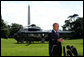 President George W. Bush delivers a statement on Iraqi elections after returning to the White House from Camp David, Sunday,Oct. 16, 2005. White House photo by Krisanne Johnson