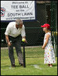 Under the watchful eye of Meredith Cripe, a member of the Chantilly, Virginia Little League Challenger League, President George W. Bush places a ball on the tee to start the game and the 2007 White House Tee Ball Season on the South Lawn. The game pitted the Bobcats from Cumberland, Maryland, against the Red Wings of Luray, Virginia. White House photo by Eric Draper