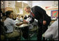 President George W. Bush meets students in the seventh grade science class at Harlem Village Academy Charter School in New York, during his visit to the school Tuesday, April 24, 2007, where President Bush spoke about his "No Child Left Behind" reauthorization proposals.  White House photo by Eric Draper