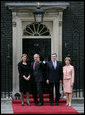 President George W. Bush waves to members of the media as he and Laura Bush are met by British Prime Minster Gordon Brown and his wife, Sarah, on their arrival Sunday, June 15, 2008 to 10 Downing Street in London.  White House photo by Chris Greenberg