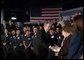 President George W. Bush greets employees of USA Industries, after a conversation on the economy and job training in Bay Shore, New York, Thursday, March 11, 2004. White House photo by Eric Draper.