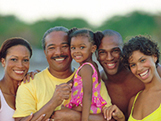 picture of a family smiling at the camera