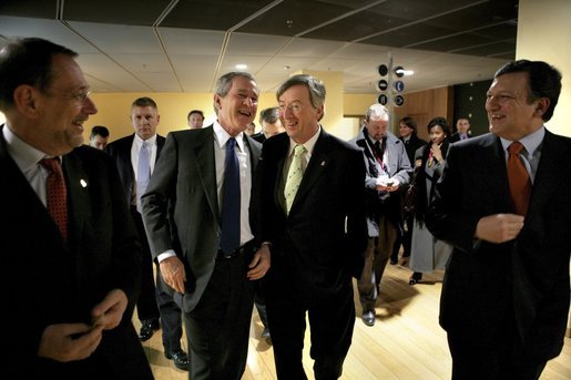 President George W. Bush laughs with, from left, European Union Council Secretariat Javier Solana, European Union President Jean-Claude Juncker and European Commission President Jose Manuel Barroso after a working dinner between the leaders in Brussels Tuesday, Feb. 22, 2005. White House photo by Eric Draper