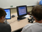 Photo of visually impaired students working through a computing challenge at ImagineIT.