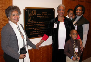 Capt. Dunn's family at the dedication ceremony in front of the memorial plaque