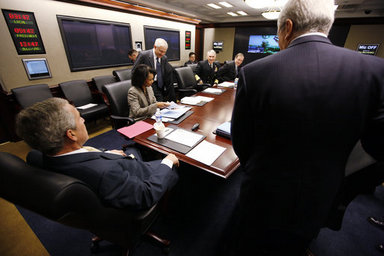  President George W. Bush is seen at a National Security Council meeting in the White House Situation Room Monday, March 24, 2008, during a video teleconference with General David Petraeus, Commander of the Multi-National Force-Iraq; and Ryan Crocker, U.S. Ambassador to Iraq. White House photo by Eric Draper