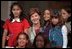 Laura Bush poses with children participating the National Book Festival Back to School event in the Great Hall at the Library of Congress Jefferson Building Sept. 7, 2001 in Washington, D.C.