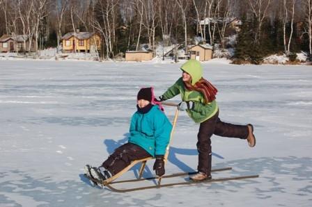 Kick sledding on a northern lake.