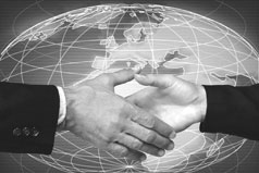 handshake in front of world map