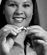 Woman breaking cigarette