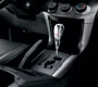 Chrome-accented shift knob with black leather inse