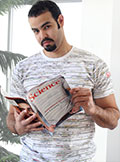 A man wearing a T-shirt covered with the annotated gene sequence map of human chromosome 1